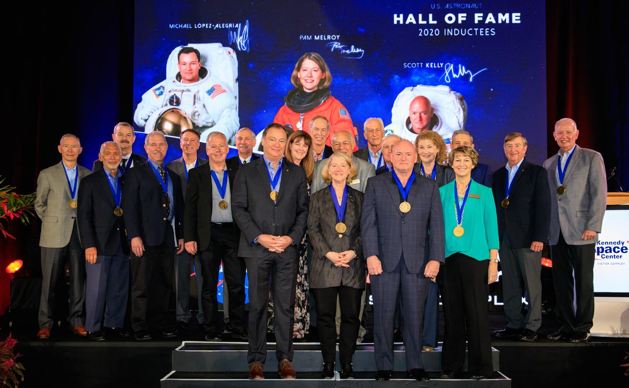 Three veteran astronauts were inducted into the U.S. Astronaut Hall of Fame (AHOF) on Nov. 13, 2021, during a ceremony at the Kennedy Space Center Visitor Complex in Florida. The new inductees in the front row – Michael Lopez-Alegria, Pam Melroy, the NASA deputy administrator, and Scott Kelly – were joined by other AHOF members after the ceremony. The three were inducted by former NASA astronaut and Hall of Famer Curt Brown, board chairman of the Astronaut Scholarship Foundation. The new inductees each received an official medal and became members of the 19th class of space shuttle astronauts to be inducted. The 2021 inductees were selected by a committee of Hall of Fame astronauts, former NASA officials, flight directors, historians, and journalists. This year’s induction brings the total number of AHOF members to 102. Photo credit: NASA/Kim Shiflett