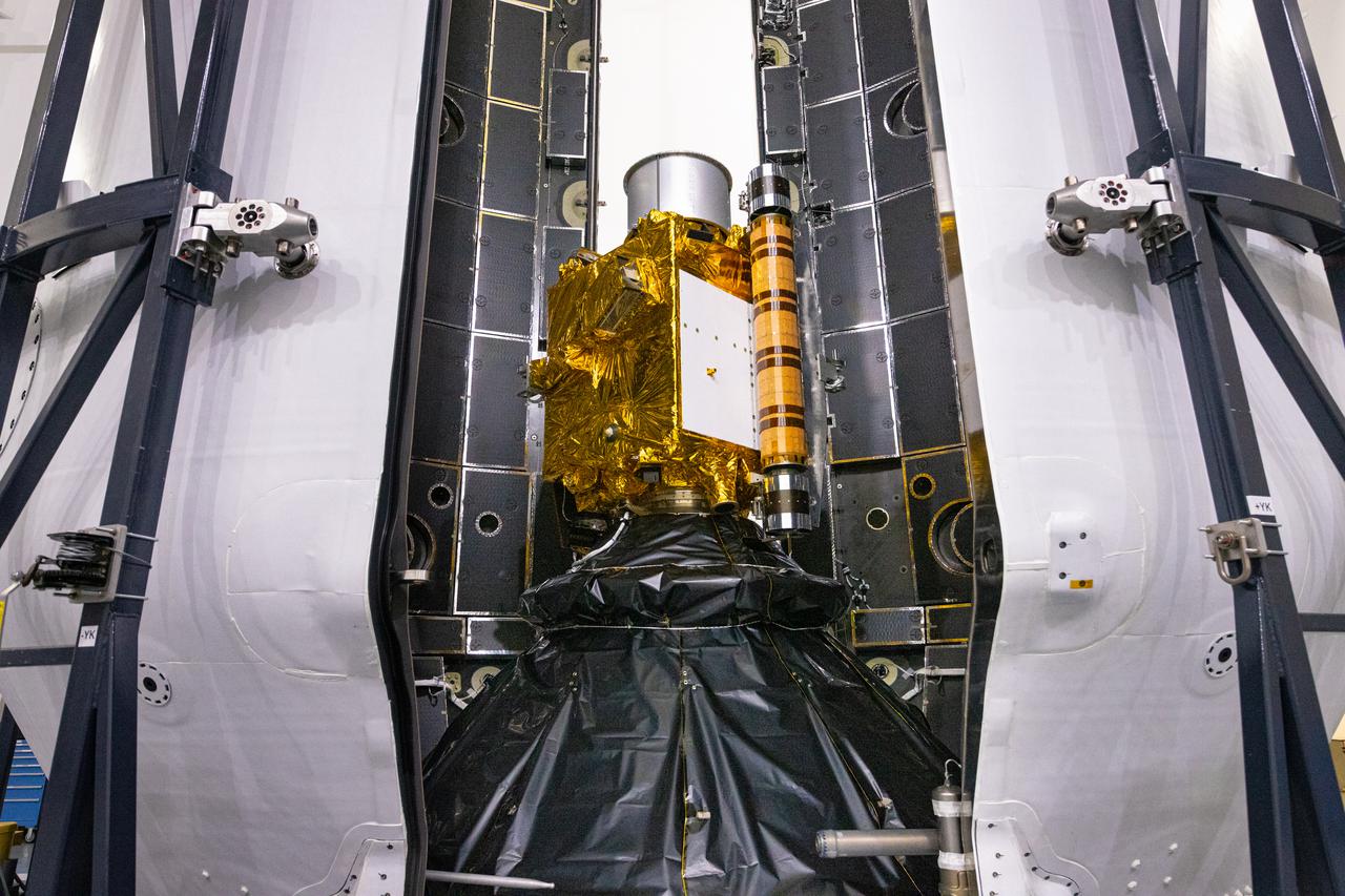 Inside SpaceX’s Payload Processing Facility at Vandenberg Space Force Base in California, both halves of the Falcon 9 rocket’s protective payload fairing move toward NASA’s Double Asteroid Redirection Test (DART) spacecraft on Nov. 16, 2021. The payload fairing, with the spacecraft securely inside, will be attached to the top of the Falcon 9 and will protect the spacecraft during launch and ascent. DART is the first mission to test technologies for preventing an impact of Earth by a hazardous asteroid. The mission is scheduled to launch no earlier than 1:21 a.m. EST Wednesday, Nov. 24 (10:21 p.m. PST Tuesday, Nov. 23), from Vandenberg’s Space Launch Complex 41. NASA's Launch Services Program based at Kennedy Space Center in Florida, America's multi-user spaceport, is managing the launch.