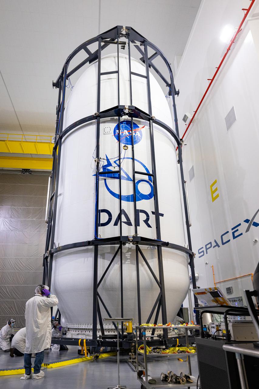 Inside SpaceX’s Payload Processing Facility at Vandenberg Space Force Base in California, both halves of the Falcon 9 rocket’s protective payload fairing are secured around NASA’s Double Asteroid Redirection Test (DART) spacecraft on Nov. 16, 2021. The payload fairing, with the spacecraft securely inside, will be attached to the top of the Falcon 9 and will protect the spacecraft during launch and ascent. DART is the first mission to test technologies for preventing an impact of Earth by a hazardous asteroid. The mission is scheduled to launch no earlier than 1:21 a.m. EST Wednesday, Nov. 24 (10:21 p.m. PST Tuesday, Nov. 23), from Vandenberg’s Space Launch Complex 41. NASA's Launch Services Program based at Kennedy Space Center in Florida, America's multi-user spaceport, is managing the launch.