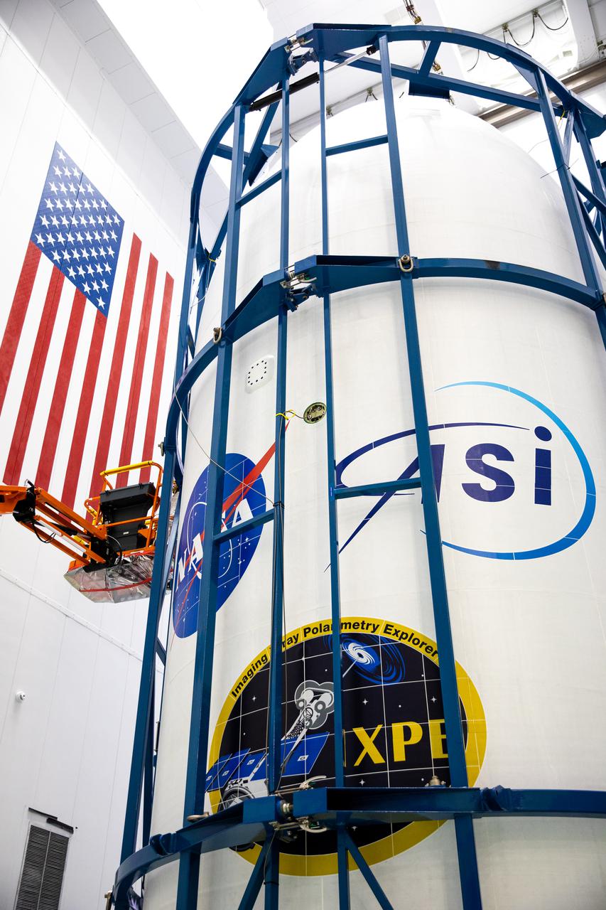 NASA’s Imaging X-Ray Polarimetry Explorer (IXPE) spacecraft and nose fairing are brought together for encapsulation inside SpaceX’s Payload Processing Facility at Kennedy Space Center in Florida on Dec. 2, 2021. The mission is scheduled to launch no earlier than Thursday, Dec. 9, at 1 a.m. EST, on a SpaceX Falcon 9 rocket from Launch Complex 39A at NASA’s Kennedy Space Center in Florida. IXPE is the first satellite dedicated to measuring the polarization of X-rays from a variety of cosmic sources, such as black holes and neutron stars.
