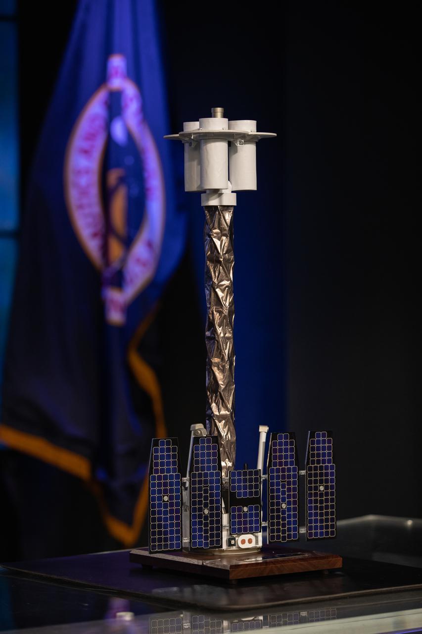A scale model of NASA’s Imaging X-ray Polarimetry Explorer (IXPE) spacecraft is on display during a payload briefing for IXPE on Dec.7, 2021 at NASA’s Kennedy Space Center in Florida. IXPE is scheduled to launch no earlier than 1 a.m. EST Thursday, Dec. 9, on a SpaceX Falcon 9 rocket from Kennedy’s Launch Complex 39A. NASA’s Launch Services Program is managing this launch. NASA’s Marshall Space Flight Center in Huntsville, Alabama, manages the IXPE mission. Ball Aerospace, headquartered in Broomfield, Colorado, manages spacecraft operations with support from the University of Colorado at Boulder. NASA’s Goddard Space Flight Center in Greenbelt, Maryland, manages the Explorers Program for the agency’s Science Mission Directorate in Washington. The U.S. Space Force’s Space Launch Delta 45 provides range support for this launch. SpaceX is providing the launch vehicle for this mission.