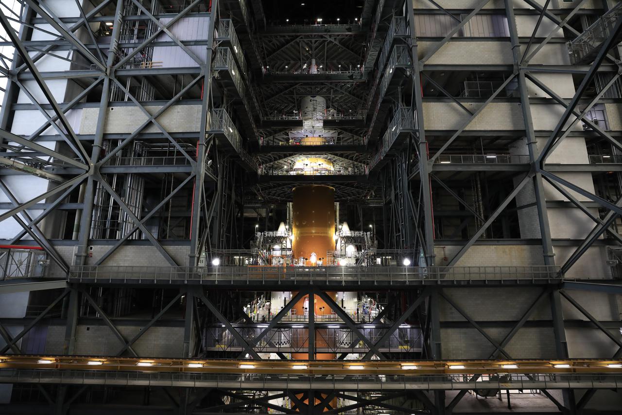 NASA’s massive Space Launch System (SLS) rocket for the agency’s Artemis I mission is shown fully stacked – with NASA’s Orion spacecraft atop – inside Kennedy Space Center’s Vehicle Assembly Building on Dec. 13, 2021. Artemis I is the inaugural launch of SLS and Orion as an integrated system. With Artemis missions, NASA will explore more of the lunar surface than ever before, using what we learn on and around the Moon to prepare for missions to Mars.