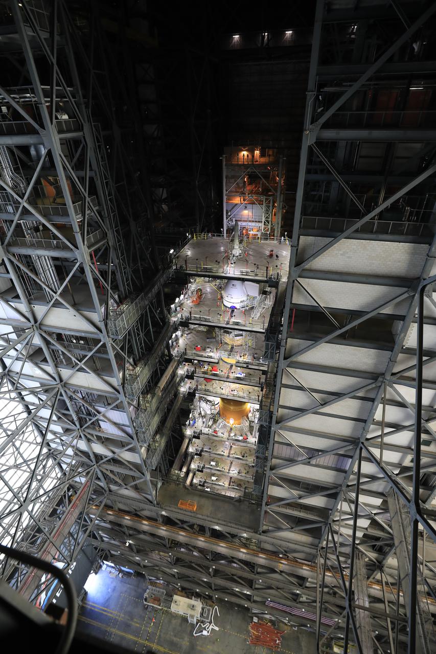 NASA’s massive Space Launch System (SLS) rocket for the agency’s Artemis I mission is shown fully stacked – with NASA’s Orion spacecraft atop – inside Kennedy Space Center’s Vehicle Assembly Building on Dec. 13, 2021. Artemis I is the inaugural launch of SLS and Orion as an integrated system. With Artemis missions, NASA will explore more of the lunar surface than ever before, using what we learn on and around the Moon to prepare for missions to Mars.