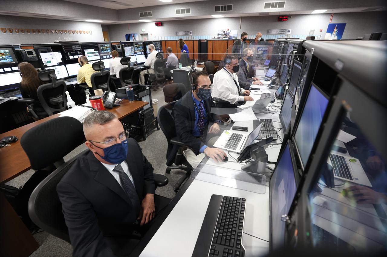 Launch team members are seated at the Integration consoles inside Firing Room 1 of the Launch Control Center at NASA’s Kennedy Space Center in Florida on Dec. 13, 2021. They are participating in a joint integrated simulation for the Artemis I launch that covered both cryogenic loading and terminal countdown portions of prelaunch activities. Members of NASA’s mission management team and launch team conducted the simulation together. The Kennedy team was certified for the Artemis I launch.  During Artemis I, the agency’s Orion spacecraft will lift off from Kennedy aboard NASA’s most powerful rocket – the Space Launch System – to fly farther than any spacecraft built for humans has ever flown. Through NASA’s Artemis missions, the agency, along with commercial and international partners, will establish a sustainable human presence on the Moon to prepare for missions to Mars. 