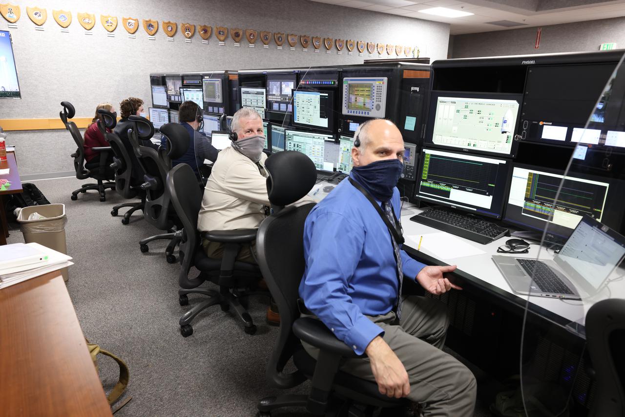 Launch team members are seated at the Environmental Control and Life Support system consoles inside Firing Room 1 of the Launch Control Center at NASA’s Kennedy Space Center in Florida on Dec. 13, 2021. They are participating in a joint integrated simulation for the Artemis I launch that covered both cryogenic loading and terminal countdown portions of prelaunch activities. Members of NASA’s mission management team and launch team conducted the simulation together. The Kennedy team was certified for the Artemis I launch. During Artemis I, the agency’s Orion spacecraft will lift off from Kennedy aboard NASA’s most powerful rocket – the Space Launch System – to fly farther than any spacecraft built for humans has ever flown. Through NASA’s Artemis missions, the agency, along with commercial and international partners, will establish a sustainable human presence on the Moon to prepare for missions to Mars. 