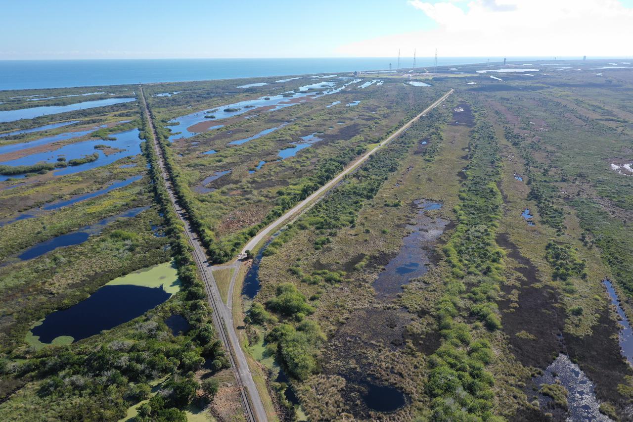 An aerial view of a proposed new launch site, Launch Complex 49, on Dec. 28, 2021, at NASA’s Kennedy Space Center in Florida. In response to an inquiry from SpaceX, NASA is preparing to conduct environmental assessments to develop the proposed launch site. The 175-acre site, located north of Launch Complex 39B within the center’s security perimeter, would support the launch and landing of SpaceX’s Starship and Super Heavy launch vehicle. NASA and SpaceX are moving forward with the initial environmental assessment before concluding a potential agreement to develop the property. 