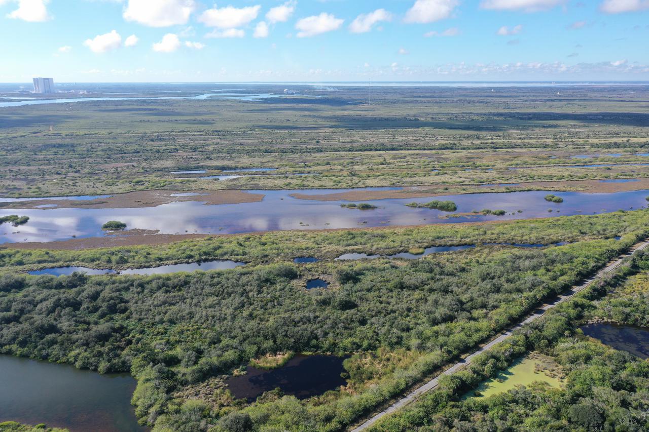 An aerial view of a proposed new launch site, Launch Complex 49, on Dec. 28, 2021, at NASA’s Kennedy Space Center in Florida. In response to an inquiry from SpaceX, NASA is preparing to conduct environmental assessments to develop the proposed launch site. The 175-acre site, located north of Launch Complex 39B within the center’s security perimeter, would support the launch and landing of SpaceX’s Starship and Super Heavy launch vehicle. NASA and SpaceX are moving forward with the initial environmental assessment before concluding a potential agreement to develop the property. 