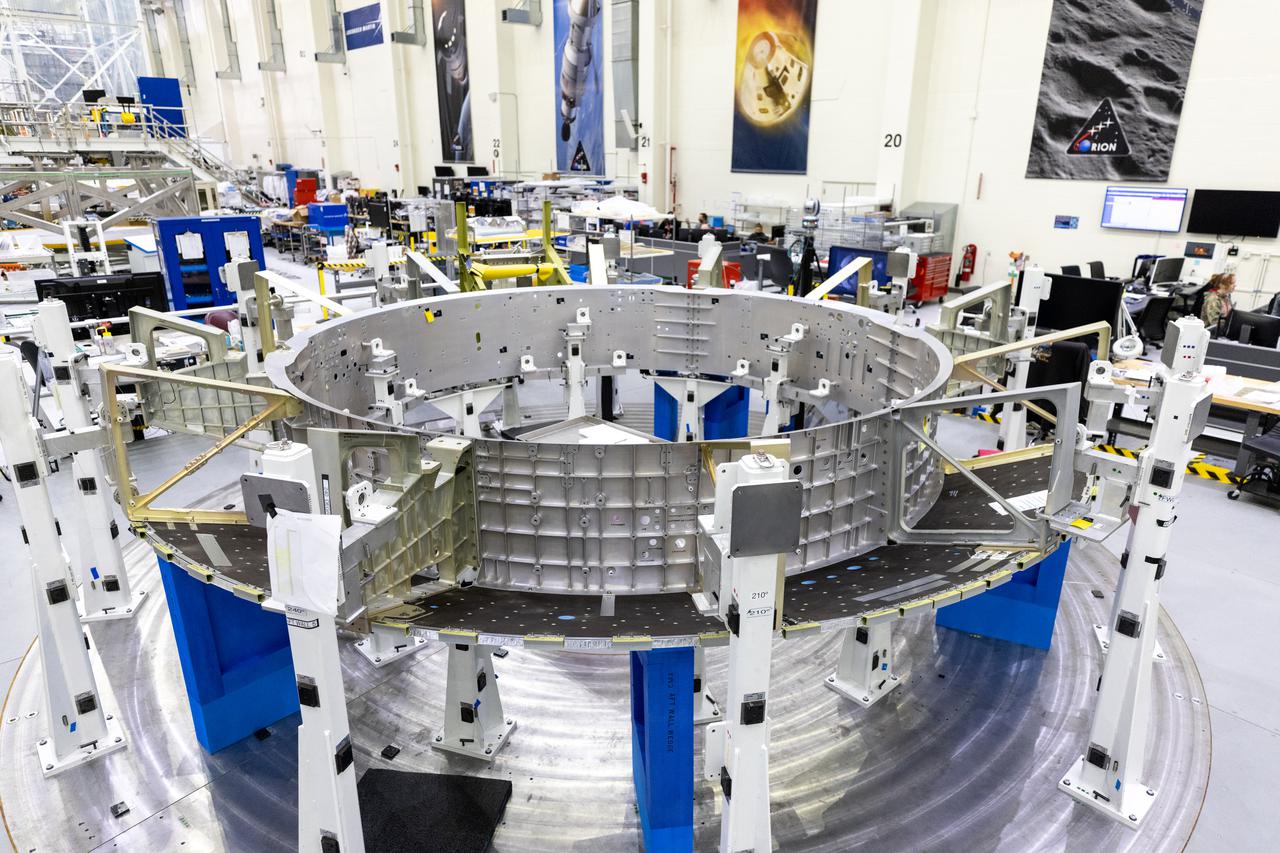 The Orion crew module adapter for NASA’s Artemis III mission is on a work stand inside the high bay of the Neil A. Armstrong Operations and Checkout Building at NASA’s Kennedy Space Center in Florida on Jan. 20, 2022. Lockheed Martin technicians continue working to install the aft walls as the ring-shaped structure is prepared to ultimately be attached to the European-built service module. Launched atop the Space Launch System rocket, Artemis missions  will aim to send astronauts, including the first woman and first person of color, on a mission to the surface of the Moon. 