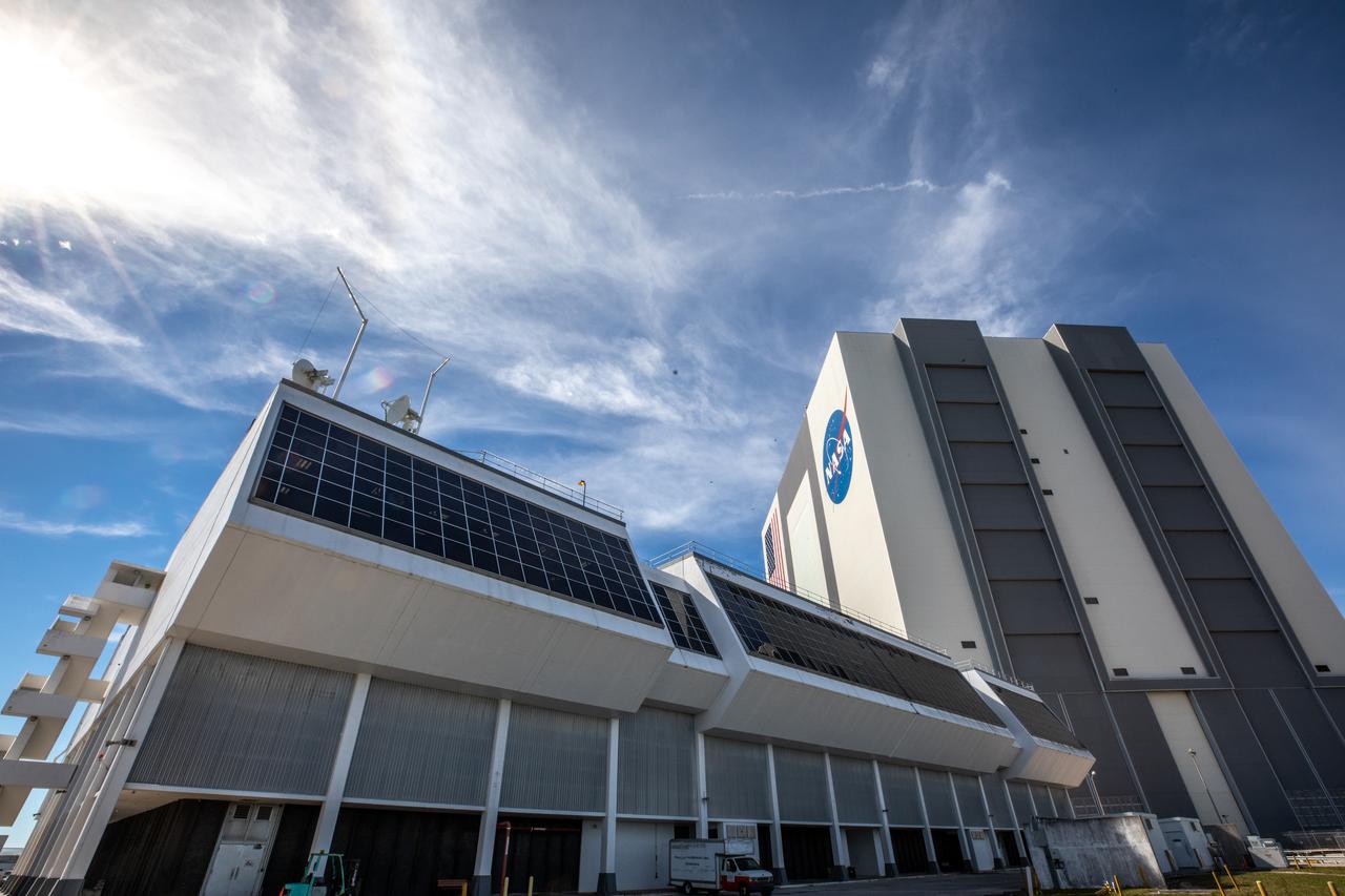 Following a ceremony at NASA’s Kennedy Space Center, the Florida spaceport’s launch control center (foreground) was officially renamed the Rocco A. Petrone Launch Control Center. In the background is Kennedy’s historic Vehicle Assembly Building. The newly named facility serves as a nerve center where engineers and the launch director will monitor their flight consoles and give the “go” for the upcoming launch of Artemis I and later missions that will establish a sustainable presence on the Moon to prepare for missions to Mars. Petrone, who was instrumental in America’s first voyages to the Moon and headed the Apollo program, died in 2006 at the age of 80.