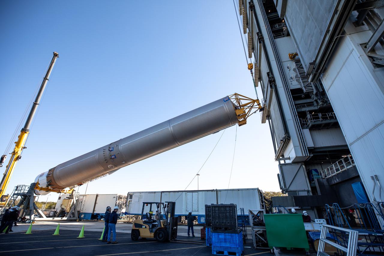 A crane is used to lift the United Launch Alliance’s (ULA) first stage of the Atlas V 541 rocket at the Space Launch Complex-41 Vertical Integration Facility at Cape Canaveral Space Force Station in Florida on Jan. 31, 2022. The Atlas V will launch the National Oceanic and Atmospheric Administration’s (NOAA) Geostationary Operational Environmental Satellite T (GOES-T). GOES-T is the third satellite in the GOES-R series that will continue to help meteorologists observe and predict local weather events that affect public safety. GOES-T is scheduled to launch from Space Launch Complex-41 on March 1, 2022. The launch is being managed by NASA’s Launch Services Program based at Kennedy Space Center, America’s multi-user spaceport. 