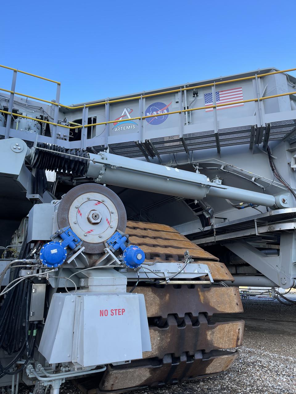 Eight new NASA Artemis logos (four large, four small) were installed on Crawler-Transporter 2 at Kennedy Space Center in preparation for the upcoming launch of Artemis I. Named after the twin sister of Apollo, Artemis is the Goddess of the Moon. The Artemis missions will take humanity back to the Moon and beyond, beginning a new legacy of deep space exploration.