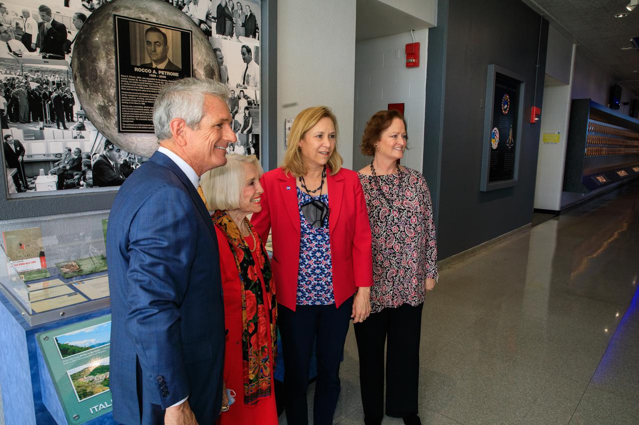 Kennedy Space Center Director Janet Petro, second from right, poses in front of a display dedicated to former Kennedy Space Center launch director Rocco Petrone at the Florida spaceport on Feb. 22, 2022. Also pictured is Scott Rigell, far left, and Kathy Posey, daughter of Petrone, far right. During a ceremony held at Kennedy, the launch control center was officially renamed to the Rocco A. Petrone Launch Control Center. Petrone was instrumental in America’s first voyages to the Moon and headed the Apollo program. He died in 2006 at the age of 80.
