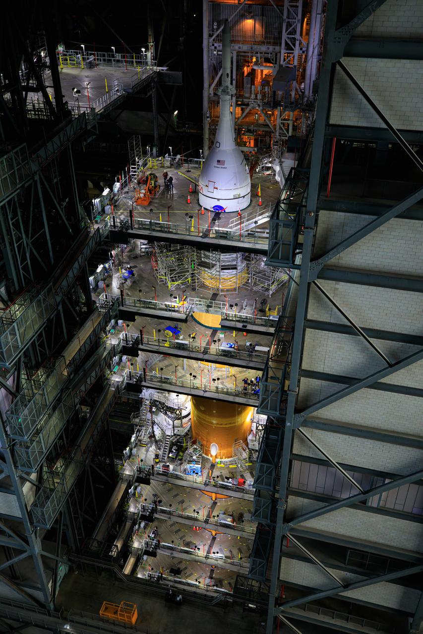 Teams retracted the first two of 20 platforms surrounding the Space Launch System rocket and Orion spacecraft that allow work on the integrated system in High Bay 3 inside the Vehicle Assembly Building at NASA’s Kennedy Space Center in Florida. The first platforms to be retracted – which move like hydraulic kitchen drawers when moved – are those located near the launch abort system on Orion in preparation for rollout to Launch Complex 39B for the Artemis I wet dress rehearsal.