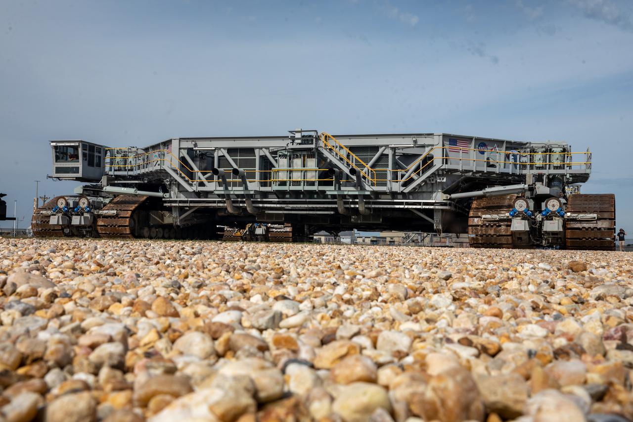 Engineers and technicians drive the crawler-transporter 2 along the crawlerway toward the Vehicle Assembly Building (VAB) at NASA’s Kennedy Space Center in Florida on March 11, 2022. The crawler will go inside the VAB, where it will slide under the Artemis I Space Launch System with the Orion spacecraft atop on the mobile launcher and carry it to Launch Complex 39B for a wet dress rehearsal test ahead of the Artemis I launch. Artemis I will be the first integrated test of the SLS and Orion spacecraft. In later missions, NASA will land the first woman and the first person of color on the surface of the Moon, paving the way for a long-term lunar presence and serving as a steppingstone on the way to Mars. 