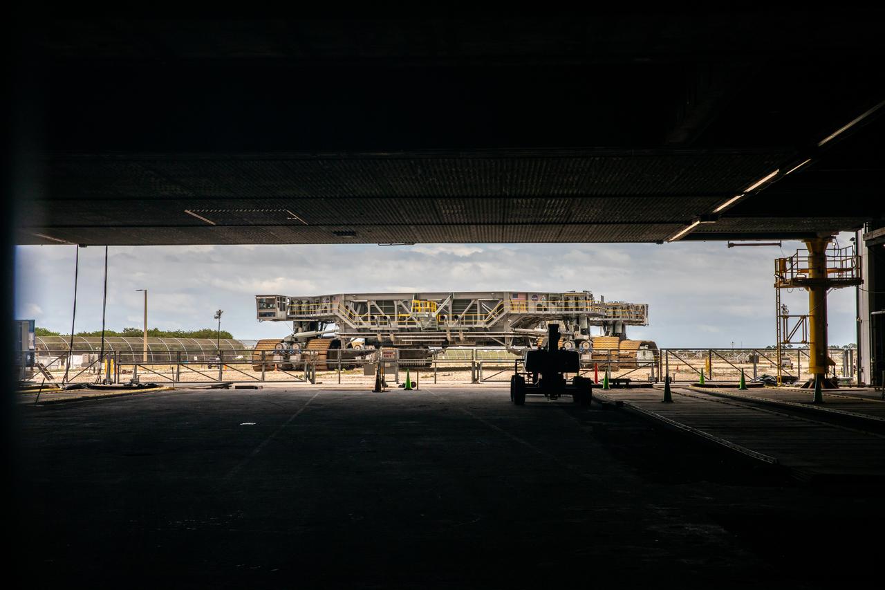 Crawler-transporter 2 is in view just outside the Vehicle Assembly Building at NASA’s Kennedy Space Center in Florida on March 14, 2022. Soon the crawler will be driven inside to transport the Space Launch System and Orion spacecraft stack atop the mobile launcher for a trip along the crawlerway to Launch Complex 39B for a wet dress rehearsal. The Kennedy ground systems team is working to remove equipment and scaffolding away from the rocket and will continue retracting the platforms until the entire rocket is revealed ahead of the wet dress rehearsal test, which is scheduled to occur approximately two weeks after it arrives to 39B. Artemis I is the first in a series of increasingly complex missions that will enable human exploration to the Moon and Mars.