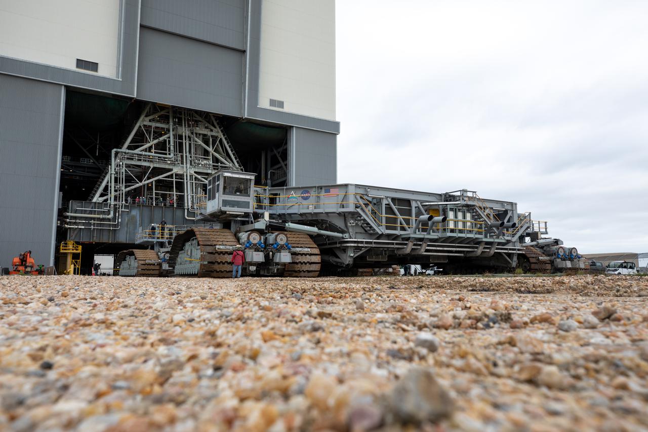 Engineers and technicians begin to drive crawler-transporter 2 inside the Vehicle Assembly Building at NASA’s Kennedy Space Center in Florida on March 15, 2022. The crawler will slide under the Artemis I Space Launch System (SLS) with the Orion spacecraft atop on the mobile launcher and carry it to Launch Complex 39B for a wet dress rehearsal test ahead of launch. Artemis I will be the first integrated test of the SLS and Orion spacecraft. In later missions, NASA will land the first woman and the first person of color on the surface of the Moon, paving the way for a long-term lunar presence and serving as a steppingstone on the way to Mars. 