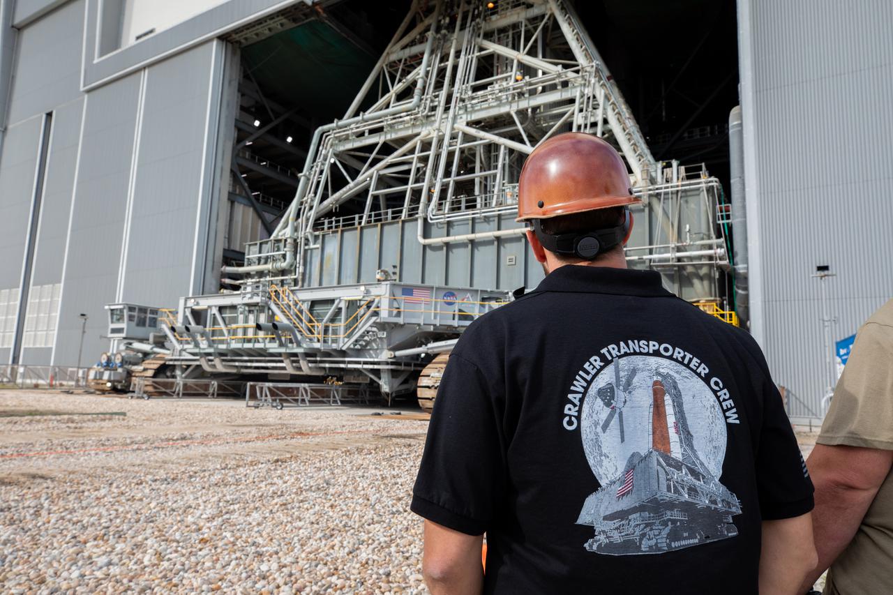 Driven by engineers and technicians, the crawler-transporter 2 slides under the Artemis I Space Launch System (SLS) with the Orion spacecraft atop on the mobile launcher inside the Vehicle Assembly Building at NASA’s Kennedy Space Center in Florida on March 15, 2022. The crawler will carry the Artemis I stack to Launch Complex 39B for a wet dress rehearsal test ahead of launch. Artemis I will be the first integrated test of the SLS and Orion spacecraft. In later missions, NASA will land the first woman and the first person of color on the surface of the Moon, paving the way for a long-term lunar presence and serving as a steppingstone on the way to Mars. 