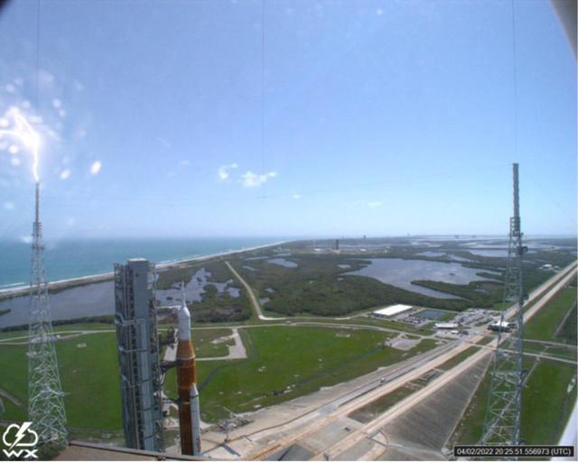 A lightning strike was recorded at Launch Complex 39B at NASA’s Kennedy Space Center in Florida during the evening of April 2, 2022. NASA’s Space Launch System (SLS) and Orion spacecraft were undergoing a prelaunch test called a wet dress rehearsal at the pad for the Artemis I mission. The lightning strike was recorded by cameras stationed at the pad and mobile launcher using a special filter called a “clear day frame,” which provides an overlay of the raw frame on a reference image. Artemis I will be the first integrated test of the SLS and Orion spacecraft. In later missions, NASA will land the first woman and the first woman of color on the surface of the Moon, paving the way for a long-term lunar presence and serving as a steppingstone on the way to Mars.