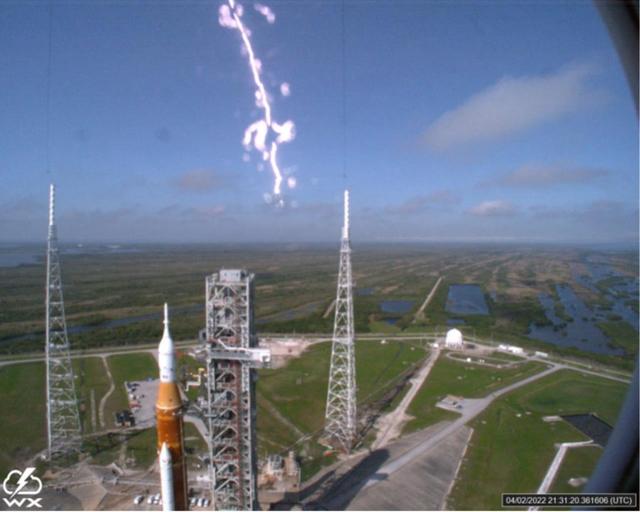 A lightning strike was recorded at Launch Complex 39B at NASA’s Kennedy Space Center in Florida during the evening of April 2, 2022. NASA’s Space Launch System (SLS) and Orion spacecraft were undergoing a prelaunch test called a wet dress rehearsal at the pad for the Artemis I mission. The lightning strike was recorded by cameras stationed at the pad and mobile launcher using a special filter called a “clear day frame,” which provides an overlay of the raw frame on a reference image. Artemis I will be the first integrated test of the SLS and Orion spacecraft. In later missions, NASA will land the first woman and the first woman of color on the surface of the Moon, paving the way for a long-term lunar presence and serving as a steppingstone on the way to Mars.