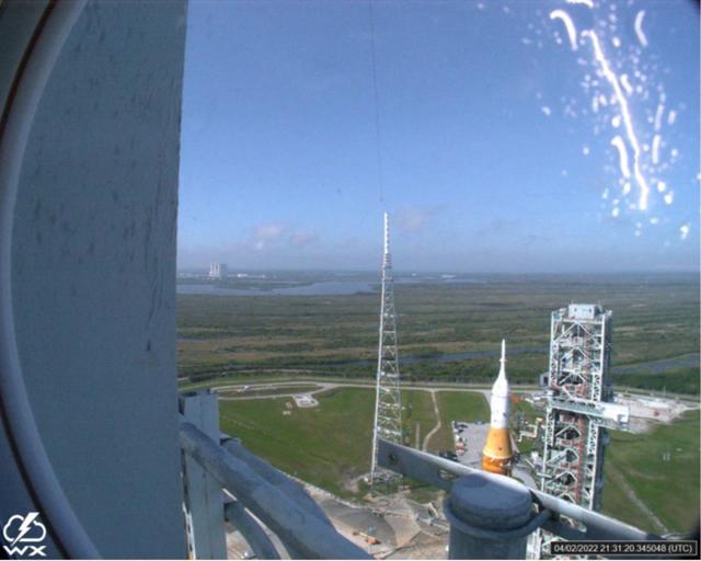 A lightning strike was recorded at Launch Complex 39B at NASA’s Kennedy Space Center in Florida during the evening of April 2, 2022. NASA’s Space Launch System (SLS) and Orion spacecraft were undergoing a prelaunch test called a wet dress rehearsal at the pad for the Artemis I mission. The lightning strike was recorded by cameras stationed at the pad and mobile launcher using a special filter called a “clear day frame,” which provides an overlay of the raw frame on a reference image. Artemis I will be the first integrated test of the SLS and Orion spacecraft. In later missions, NASA will land the first woman and the first woman of color on the surface of the Moon, paving the way for a long-term lunar presence and serving as a steppingstone on the way to Mars.
