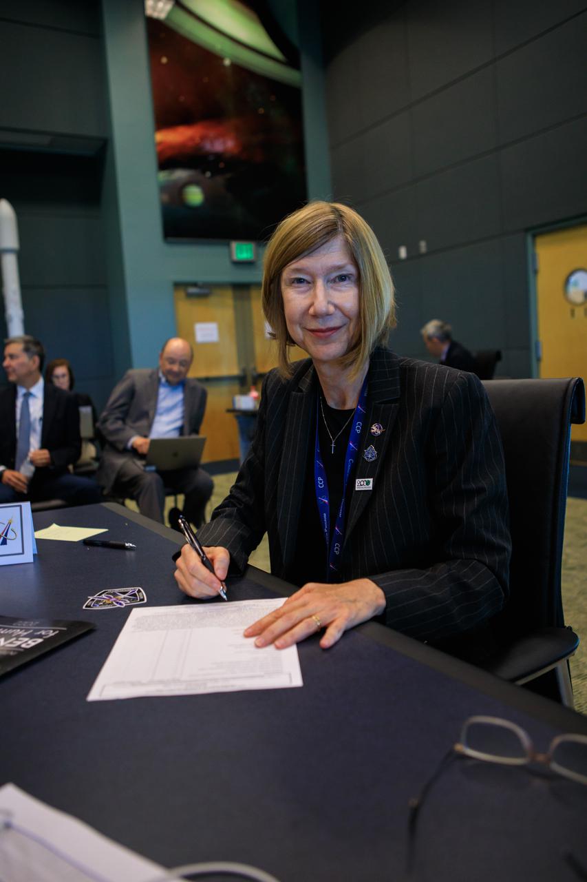 Kathy Lueders, associate administrator, Space Operations Mission Directorate, NASA Headquarters, signs a document during the Flight Readiness Review for the agency’s SpaceX Crew-4 mission at the agency’s Kennedy Space Center in Florida on April 15, 2022. International partners also participated. NASA and SpaceX mission managers held the review to confirm the SpaceX Falcon 9 rocket and Crew Dragon spacecraft are ready for launch. Crew-4 is scheduled to launch to the International Space Station from Kennedy’s Launch Complex 39A on April 23, 2022, as part of NASA’s Commercial Crew Program. Liftoff of the Falcon 9 rocket and Crew Dragon spacecraft is targeted for 5:26 a.m. EDT.