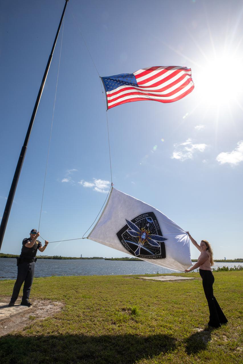 NASA’s SpaceX Crew-4 flag is raised near the News Center countdown clock at NASA’s Kennedy Space Center in Florida on April 19, 2022. The SpaceX Falcon 9 with Crew Dragon, named Freedom by the Crew-4 crew, atop is scheduled to lift off Saturday, April 23, 2002, at 5:26 p.m. EDT, from Launch Complex 39A at Kennedy. Dragon will carry NASA astronauts Kjell Lindgren, Bob Hines, and Jessica Watkins, and ESA (European Space Agency) astronaut Samantha Cristoforetti to the International Space Station as part of NASA’s Commercial Crew Program.