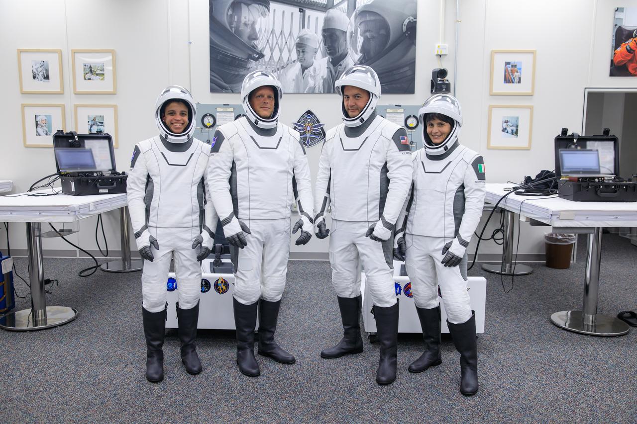 Crew-4 mission astronauts participate in NASA’s SpaceX Crew-4 dry dress rehearsal in the suit room inside Kennedy Space Center’s Neil A. Armstrong Operations and Checkout Building on April 20, 2022. A team of SpaceX suit technicians assisted them as they put on their custom-fitted spacesuits and checked the suits for leaks. From left are: Jessica Watkins, mission specialist; Bob Hines, pilot; Kjell Lindgren, commander; and Samantha Cristoforetti, mission specialist. SpaceX’s Falcon 9 rocket and Crew Dragon, named Freedom by the Crew-4 crew, will launch the astronauts to the International Space Station as part of NASA’s Commercial Crew Program. The mission is scheduled to lift off at 5:26 a.m. EDT on April 23, 2022, from Launch Complex 39A at Kennedy.