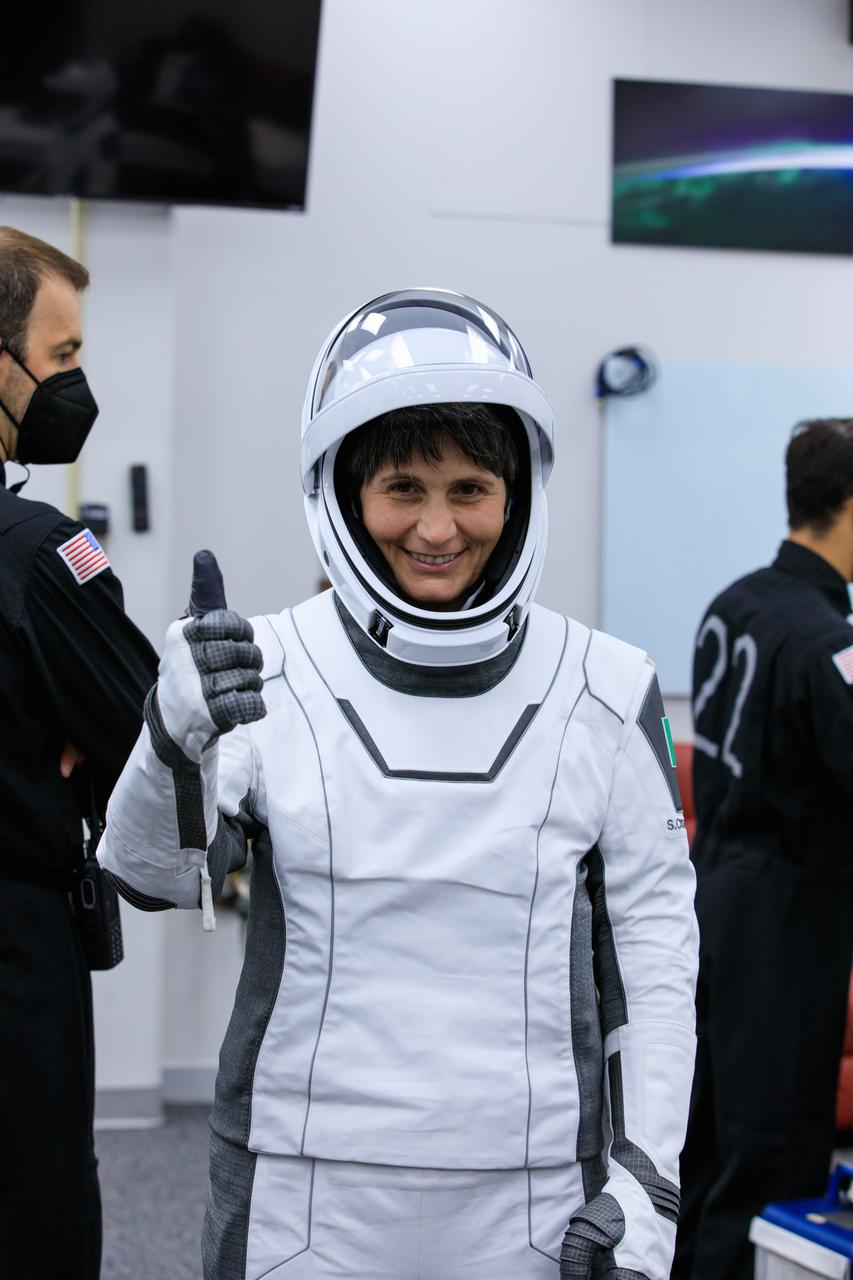 ESA (European Space Agency) astronaut Samantha Cristoforetti gives a thumbs-up in the suit room inside Kennedy Space Center’s Neil A. Armstrong Operations and Checkout Building during Crew-4 dry dress rehearsal on April 20, 2022. Cristoforetti, along with fellow Crew-4 astronauts Kjell Lindgren, Bob Hines, and Jessica Watkins, is scheduled to lift off from Kennedy’s Launch Complex 39A at 5:26 a.m. EDT on April 23, 2022. SpaceX’s Falcon 9 rocket and Crew Dragon, named Freedom by the Crew-4 crew, will launch the astronauts to the International Space Station as part of NASA’s Commercial Crew Program.
