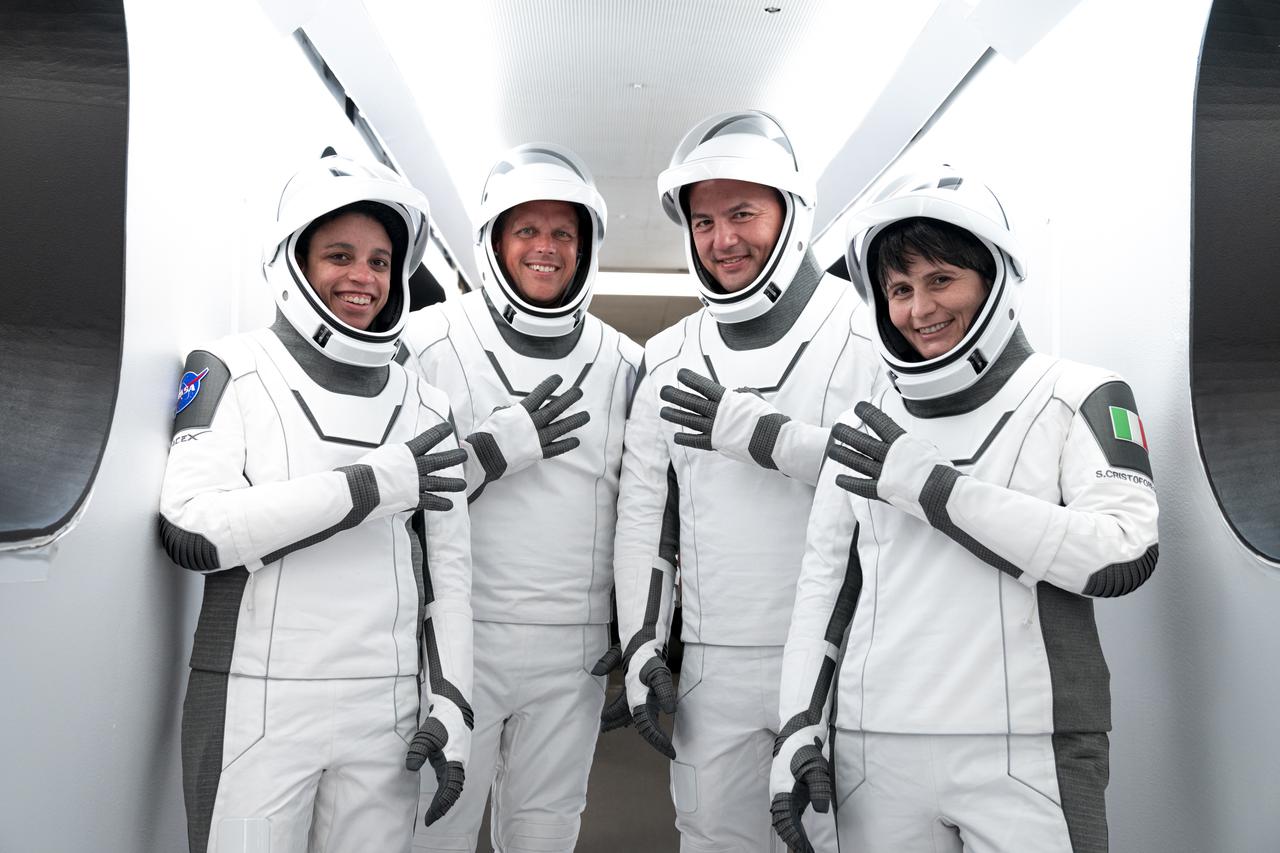 Crew-4 astronauts, from left, Jessica Watkins, mission specialist; Bob Hines, pilot; Kjell Lindgren, commander and Samantha Cristoforetti, mission specialist, pose outside SpaceX’s Crew Dragon, named Freedom by the Crew-4 crew, during a dry dress rehearsal at Kennedy Space Center in Florida on April 20, 2022. Crew-4 will launch the astronauts to the International Space Station as part of NASA’s Commercial Crew Program. Liftoff is targeted for 5:26 a.m. EDT on Saturday, April 23, 2022, from Launch Complex 39A at Kennedy.