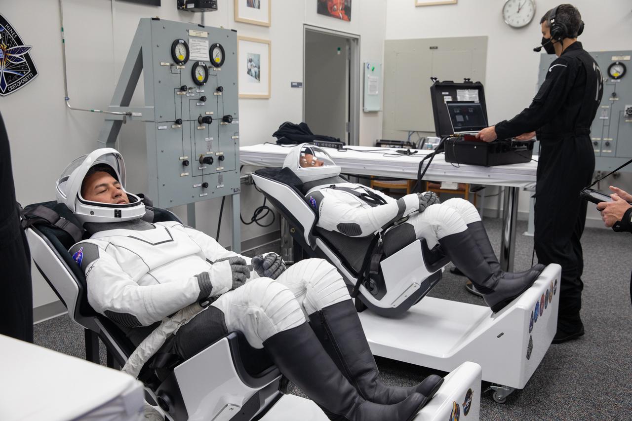 Crew-4 mission astronauts Kjell Lindgren, left, and Bob Hines relax in the suit room in the Astronaut Crew Quarters inside Kennedy Space Center’s Neil A. Armstrong Operations and Checkout Building on April 27, 2022. A team of SpaceX suit technicians assisted the crew as they put on their custom-fitted spacesuits and checked the suits for leaks. Astronauts Jessica Watkins and Samantha Cristoforetti will join Lindgren and Hines aboard SpaceX’s Crew Dragon, powered by the company’s Falcon 9 rocket, which will carry the four-person crew to the International Space Station as part of NASA’s Commercial Crew Program. Crew-4 is scheduled to lift off today at 3:52 a.m. EDT from Launch Complex 39A at Kennedy.