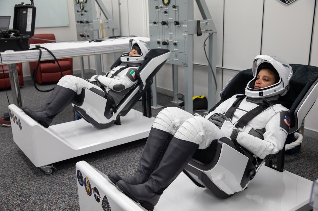 Crew-4 mission astronauts Samantha Cristoforetti, left, and Jessica Watkins relax in the suit room in the Astronaut Crew Quarters inside Kennedy Space Center’s Neil A. Armstrong Operations and Checkout Building on April 27, 2022. A team of SpaceX suit technicians assisted the crew as they put on their custom-fitted spacesuits and checked the suits for leaks. Astronauts Kjell Lindgren and Bob Hines will join Cristoforetti and Watkins aboard SpaceX’s Crew Dragon, powered by the company’s Falcon 9 rocket, which will carry the four-person crew to the International Space Station as part of NASA’s Commercial Crew Program. Crew-4 is scheduled to lift off today at 3:52 a.m. EDT from Launch Complex 39A at Kennedy.