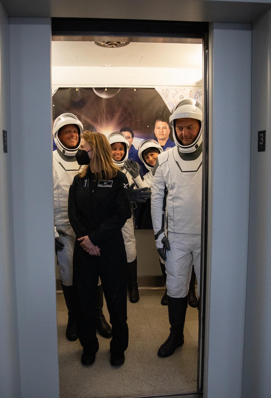 Crew-4 mission astronauts Kjell Lindgren, Bob Hines, Jessica Watkins, and Samantha Cristoforetti, enter the elevator in the Astronaut Crew Quarters inside Kennedy Space Center’s Neil A. Armstrong Operations and Checkout Building on April 27, 2022. A team of SpaceX suit technicians assisted the crew as they put on their custom-fitted spacesuits and checked the suits for leaks. The four astronauts will launch aboard SpaceX’s Crew Dragon, powered by the company’s Falcon 9 rocket, to the International Space Station as part of NASA’s Commercial Crew Program. Crew-4 is scheduled to lift off today at 3:52 a.m. EDT from Launch Complex 39A at Kennedy.