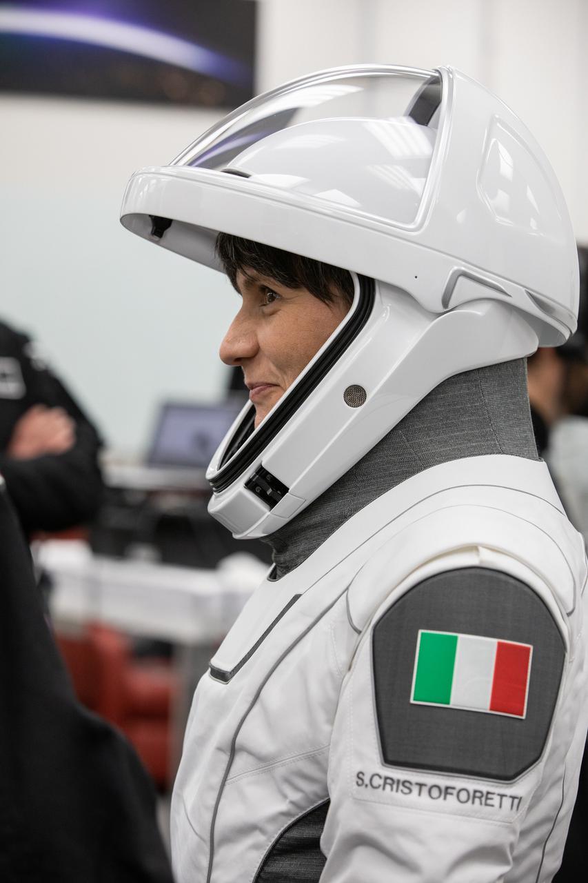 Crew-4 mission astronaut Samantha Cristoforetti smiles in the suit room in the Astronaut Crew Quarters inside Kennedy Space Center’s Neil A. Armstrong Operations and Checkout Building on April 27, 2022. A team of SpaceX suit technicians assisted Cristoforetti, along with Crew-4 members Kjell Lindgren, Bob Hines, and Jessica Watkins, as they put on their custom-fitted spacesuits and checked the suits for leaks. The four astronauts will launch aboard SpaceX’s Crew Dragon, powered by the company’s Falcon 9 rocket, to the International Space Station as part of NASA’s Commercial Crew Program. Crew-4 is scheduled to lift off today at 3:52 a.m. EDT from Launch Complex 39A at Kennedy.