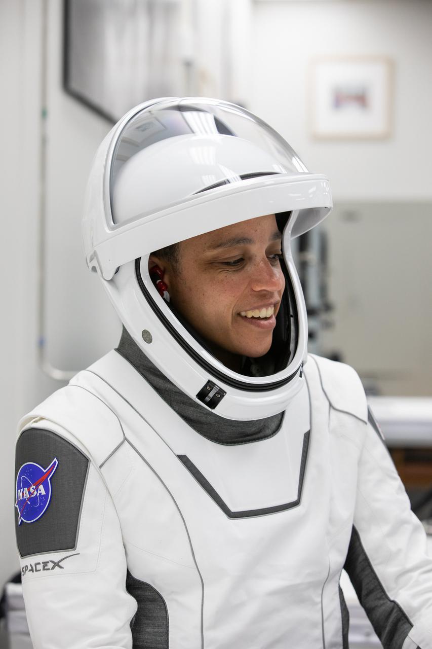 Crew-4 mission astronaut Jessica Watkins smiles in the suit room in the Astronaut Crew Quarters inside Kennedy Space Center’s Neil A. Armstrong Operations and Checkout Building on April 27, 2022. A team of SpaceX suit technicians assisted Watkins, along with Crew-4 members Kjell Lindgren, Bob Hines, and Samantha Cristoforetti, as they put on their custom-fitted spacesuits and checked the suits for leaks. The four astronauts will launch aboard SpaceX’s Crew Dragon, powered by the company’s Falcon 9 rocket, to the International Space Station as part of NASA’s Commercial Crew Program. Crew-4 is scheduled to lift off today at 3:52 a.m. EDT from Launch Complex 39A at Kennedy.