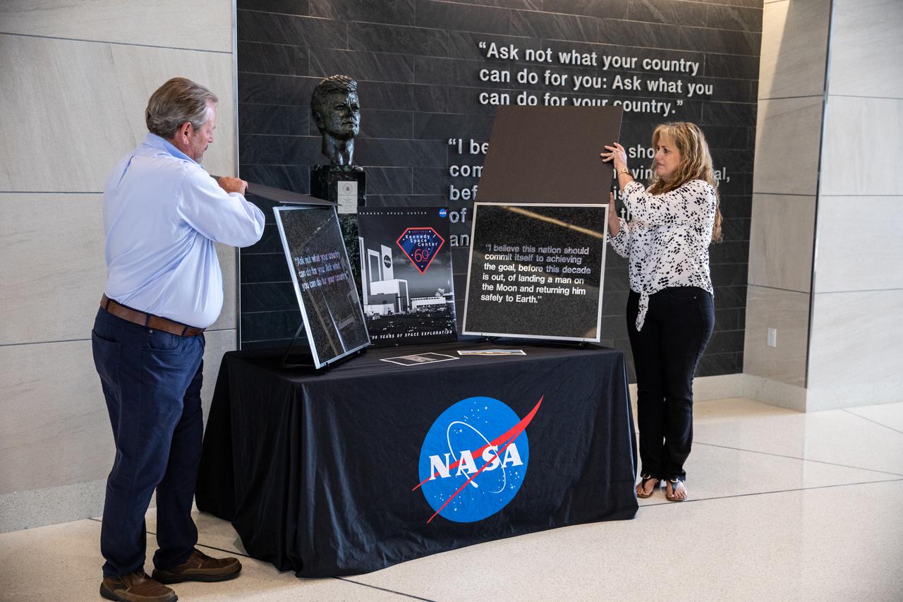 Wall tiles from Kennedy Space Center’s former headquarters building are presented to Kennedy Director Janet Petro inside the Florida spaceport’s Central Campus Headquarters Building on May 3, 2022. The two 15-pound sections from the building were preserved by Maverick Constructors LLC, the construction company that completed demolition of the structure. The company’s presentation of the tiles is in honor of the many civil servants and contractors who dedicated their lives to working for and supporting NASA in this building. Shown in the photo are Maverick East Coast division manager Ralph Kennedy and Sheri LaShier.