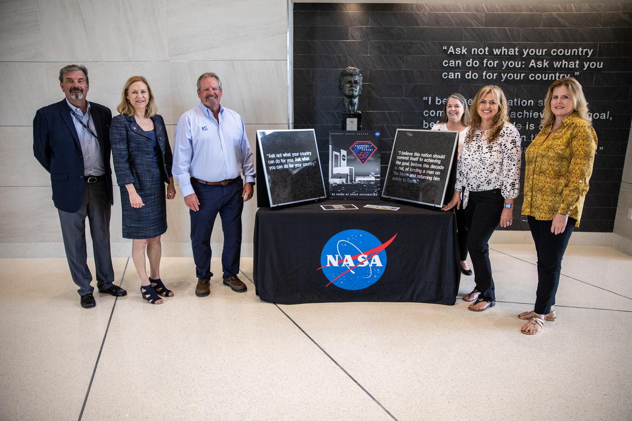 Kennedy Space Center Director Janet Petro, second from left, poses with Maverick Constructors LLC employees, from left, Carlos Rodriguez, president, Ralph Kennedy, East Coast division manager, Liz McGrath, Sheri LaShier, and Stephanie Liquori inside Kennedy’s Central Campus Headquarters Building on May 3, 2022. Maverick, the construction company that completed the demolition of Kennedy’s former headquarters, presented Petro with two preserved sections of the building. The presentation of the 15-pound wall tiles is in honor of the many civil servants and contractors who dedicated their lives to working for and supporting NASA in this building.