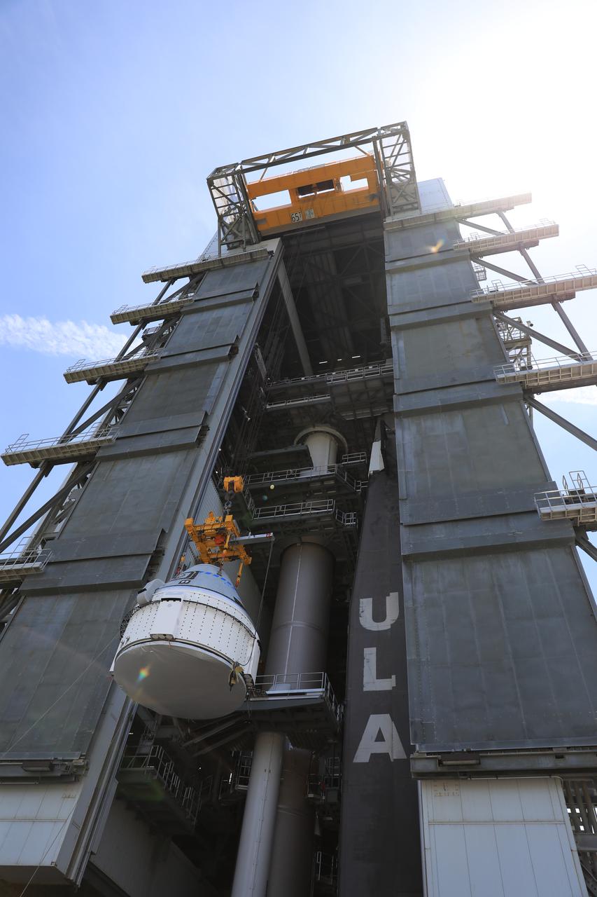 The Boeing CST-100 Starliner spacecraft is lifted at the Vertical Integration Facility at Space Launch Complex-41 at Florida’s Cape Canaveral Space Force Station on May 4, 2022. Starliner will be secured atop a United Launch Alliance Atlas V rocket for Boeing’s second Orbital Flight Test (OFT-2) to the International Space Station for NASA’s Commercial Crew Program. The spacecraft rolled out from Boeing’s Commercial Crew and Cargo Processing Facility at NASA’s Kennedy Space Center earlier in the day.