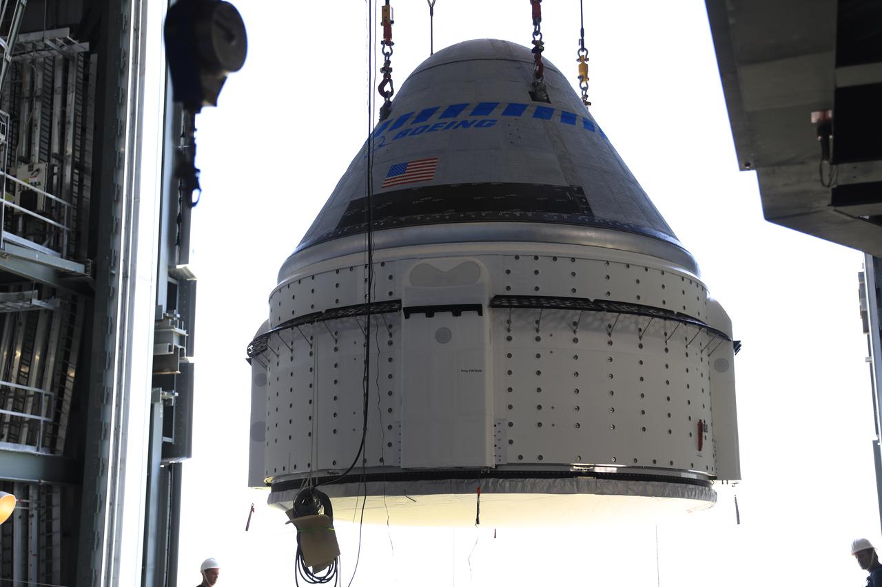 The Boeing CST-100 Starliner spacecraft is lifted at the Vertical Integration Facility at Space Launch Complex-41 at Florida’s Cape Canaveral Space Force Station on May 4, 2022. Starliner will be secured atop a United Launch Alliance Atlas V rocket for Boeing’s second Orbital Flight Test (OFT-2) to the International Space Station for NASA’s Commercial Crew Program. The spacecraft rolled out from Boeing’s Commercial Crew and Cargo Processing Facility at NASA’s Kennedy Space Center earlier in the day.