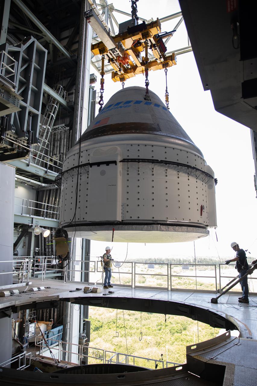 The Boeing CST-100 Starliner spacecraft is lifted at the Vertical Integration Facility at Space Launch Complex-41 at Florida’s Cape Canaveral Space Force Station on May 4, 2022. Starliner will be secured atop a United Launch Alliance Atlas V rocket for Boeing’s second Orbital Flight Test (OFT-2) to the International Space Station for NASA’s Commercial Crew Program. The spacecraft rolled out from Boeing’s Commercial Crew and Cargo Processing Facility at NASA’s Kennedy Space Center earlier in the day.