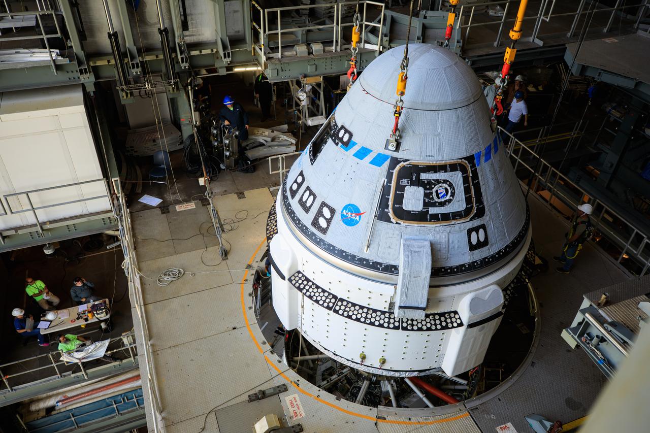 The Boeing CST-100 Starliner spacecraft is lifted at the Vertical Integration Facility at Space Launch Complex-41 at Florida's Cape Canaveral Space Force Station on May 4th, 2022. Starliner will be secured atop a United Launch Alliance Atlas V rocket for Boeing's second Orbital Flight Test (OFT-2) to the International Space Station for NASA's Commercial Crew Program. The spacecraft rolled out from Boeing's Commercial Crew and Cargo Processing Facility at NASA's Kennedy Space Center earlier in the day.