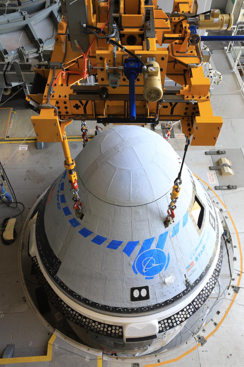 The Boeing CST-100 Starliner spacecraft is lifted at the Vertical Integration Facility at Space Launch Complex-41 at Florida’s Cape Canaveral Space Force Station on May 4, 2022. Starliner will be secured atop a United Launch Alliance Atlas V rocket for Boeing’s second Orbital Flight Test (OFT-2) to the International Space Station for NASA’s Commercial Crew Program. The spacecraft rolled out from Boeing’s Commercial Crew and Cargo Processing Facility at NASA’s Kennedy Space Center earlier in the day.