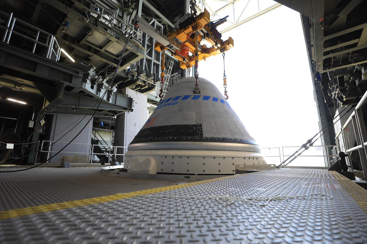 The Boeing CST-100 Starliner spacecraft is lifted at the Vertical Integration Facility at Space Launch Complex-41 at Florida’s Cape Canaveral Space Force Station on May 4, 2022. Starliner will be secured atop a United Launch Alliance Atlas V rocket for Boeing’s second Orbital Flight Test (OFT-2) to the International Space Station for NASA’s Commercial Crew Program. The spacecraft rolled out from Boeing’s Commercial Crew and Cargo Processing Facility at NASA’s Kennedy Space Center earlier in the day.
