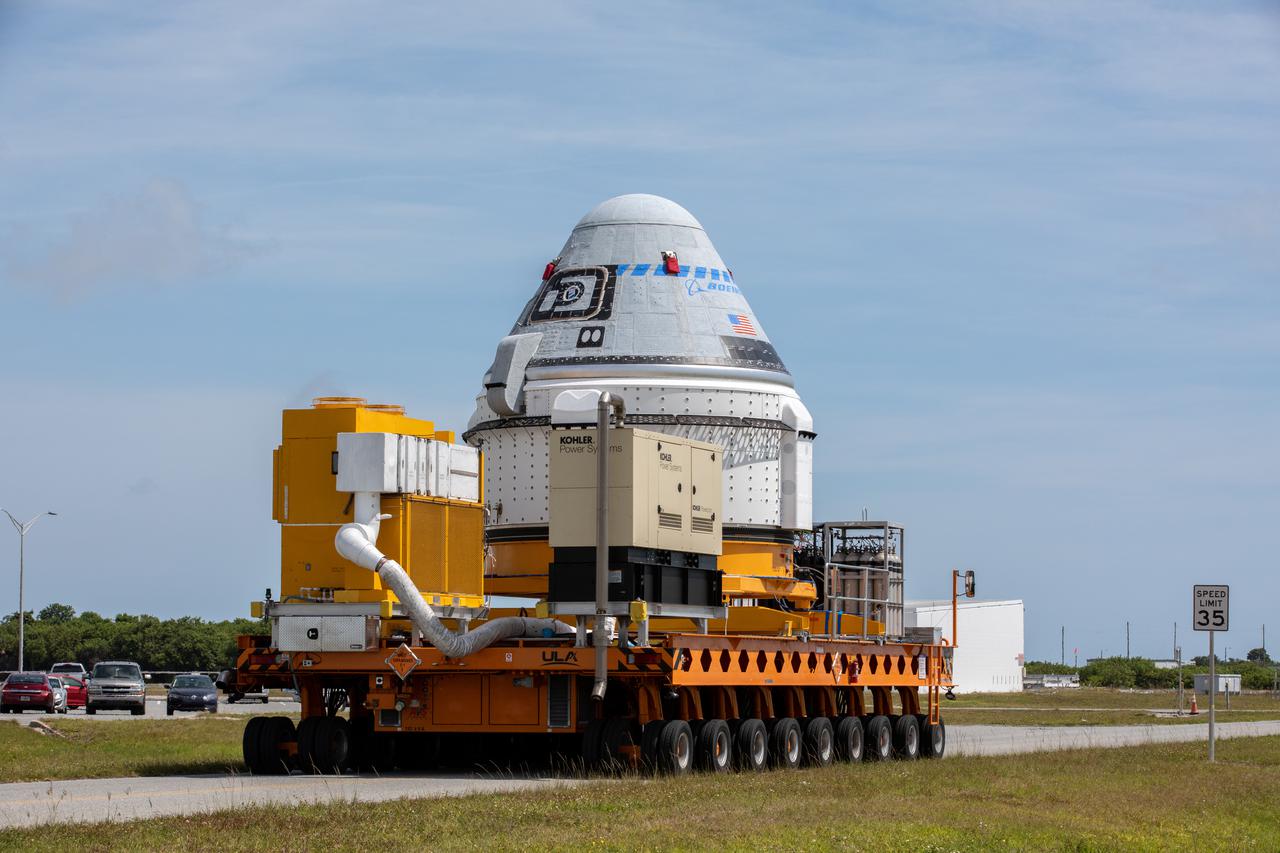 Boeing’s CST-100 Starliner spacecraft rolls out from the company’s Commercial Crew and Cargo Processing Facility at NASA’s Kennedy Space Center in Florida on May 4, 2022. The spacecraft will make the trip to the Vertical Integration Facility at Space Launch Complex-41 at Cape Canaveral Space Force Station where it will be secured atop a United Launch Alliance Atlas V rocket for Boeing’s second Orbital Flight Test (OFT-2) to the International Space Station for NASA’s Commercial Crew Program.