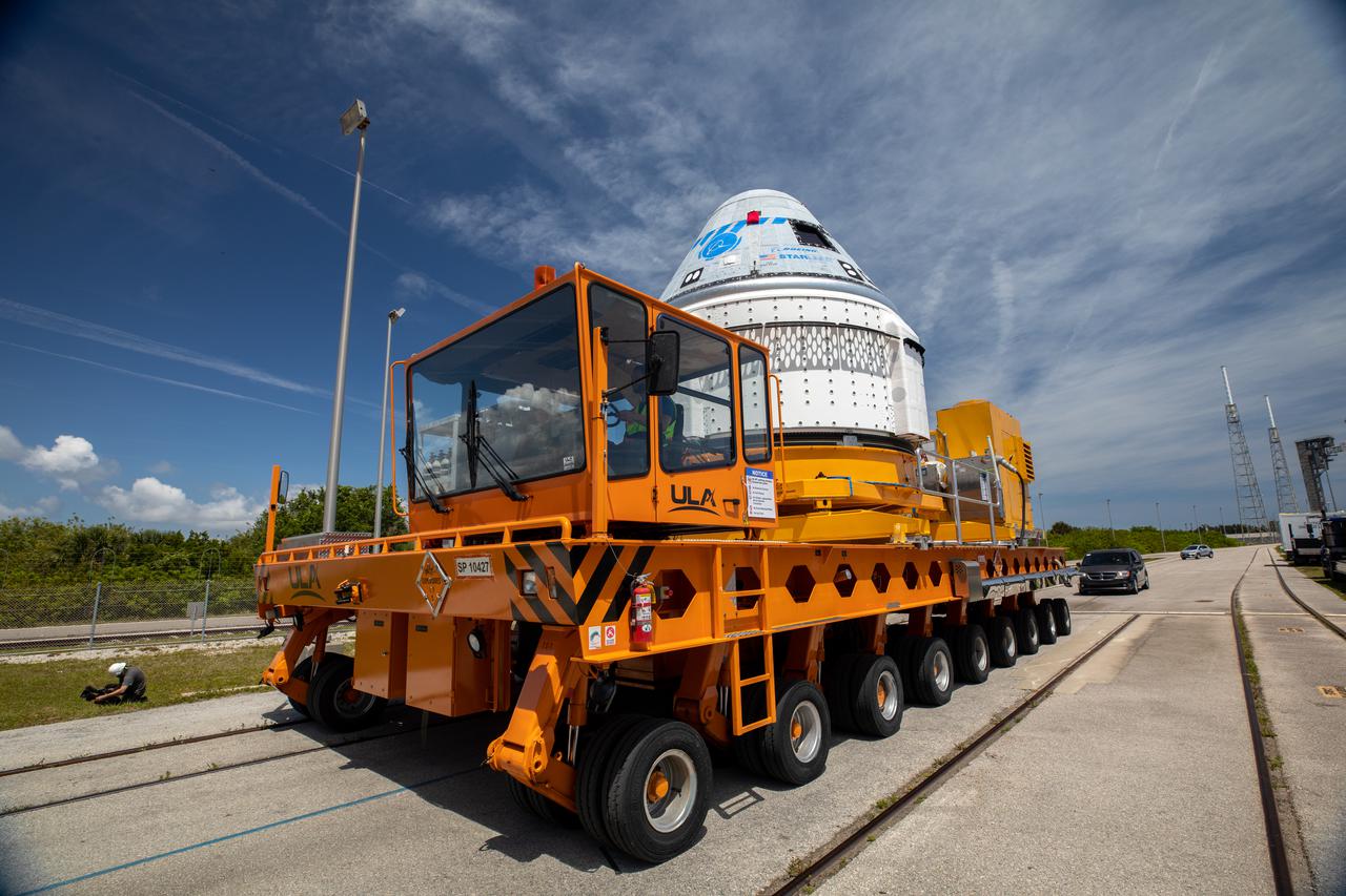 Boeing’s CST-100 Starliner spacecraft rolls out from the company’s Commercial Crew and Cargo Processing Facility at NASA’s Kennedy Space Center in Florida on May 4, 2022. The spacecraft will make the trip to the Vertical Integration Facility at Space Launch Complex-41 at Cape Canaveral Space Force Station where it will be secured atop a United Launch Alliance Atlas V rocket for Boeing’s second Orbital Flight Test (OFT-2) to the International Space Station for NASA’s Commercial Crew Program.