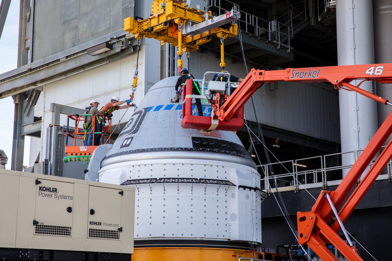 The Boeing CST-100 Starliner spacecraft is lifted at the Vertical Integration Facility at Space Launch Complex-41 at Florida’s Cape Canaveral Space Force Station on May 4, 2022. Starliner will be secured atop a United Launch Alliance Atlas V rocket for Boeing’s second Orbital Flight Test (OFT-2) to the International Space Station for NASA’s Commercial Crew Program. The spacecraft rolled out from Boeing’s Commercial Crew and Cargo Processing Facility at NASA’s Kennedy Space Center earlier in the day.