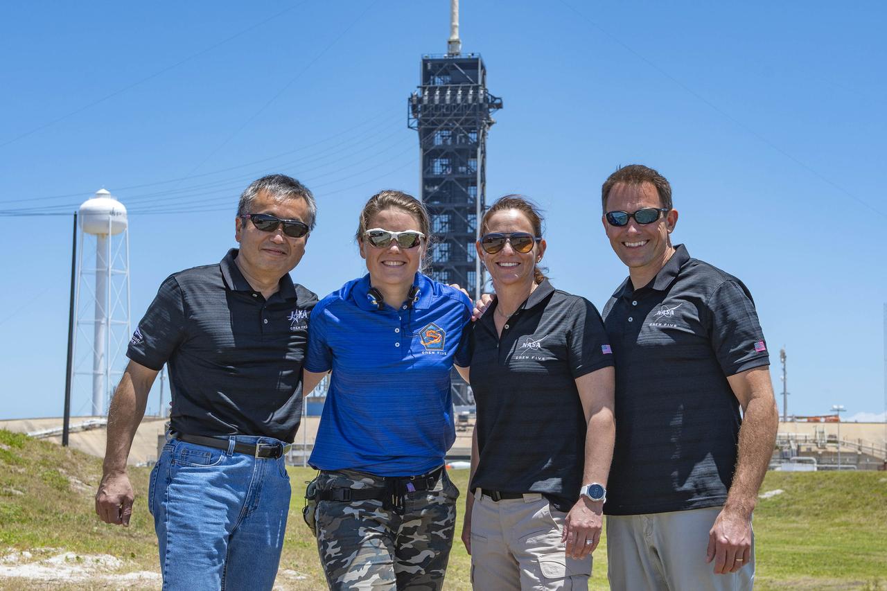 The crew members who will fly on NASA’s SpaceX Crew-5 mission to the International Space Station are photographed at Launch Complex 39A during a visit to the agency’s Kennedy Space Center in Florida on May 10, 2022. From left are JAXA (Japan Aerospace Exploration Agency) astronaut Koichi Wakata, mission specialist; Roscosmos cosmonaut Anna Kikina, mission specialist; NASA astronaut Nicole Mann, mission commander; and NASA astronaut Josh Cassada, pilot. SpaceX’s Falcon 9 rocket and Crew Dragon spacecraft are scheduled to lift off from Kennedy’s Launch Complex 39A on Oct. 3, 2022. This will be the fifth crew rotation mission of SpaceX’s human transportation system and its sixth flight with astronauts to the space station for NASA’s Commercial Crew Program.