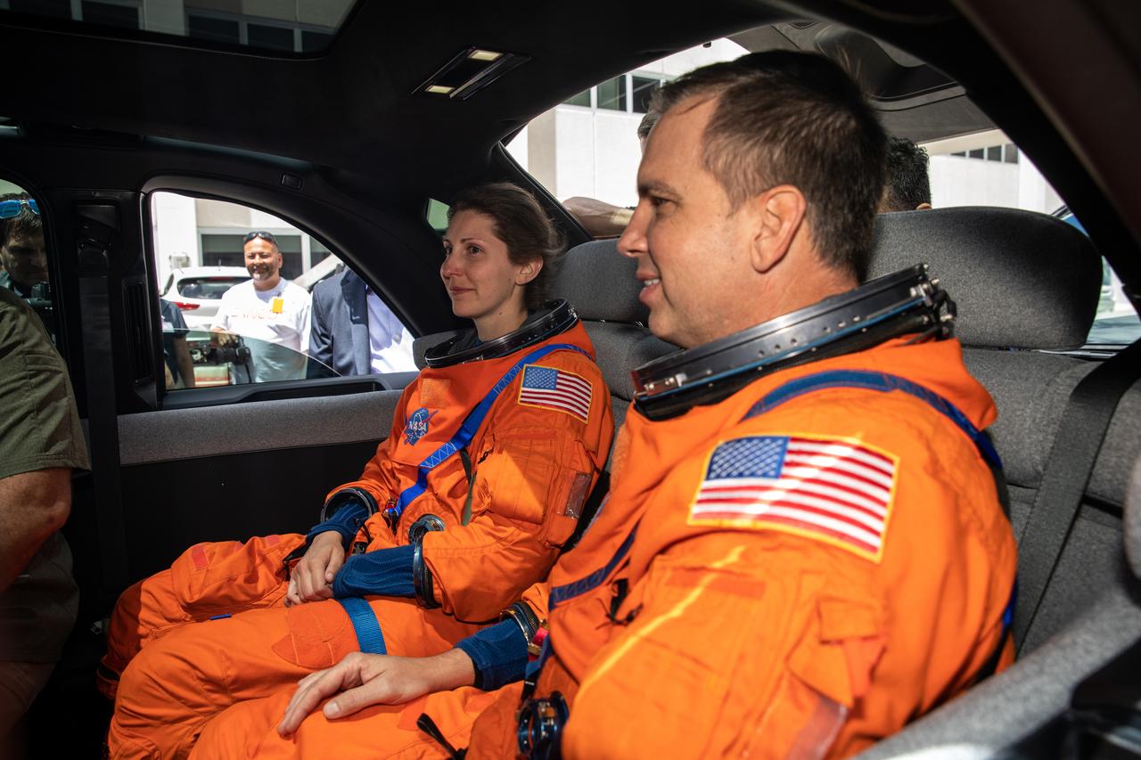 Technicians from Johnson Space Center, dressed in flight suits, secure themselves inside a prototype of a crew transportation vehicle (CTV) for Artemis crewed missions outside the Neil Armstrong Operations and Checkout Building at NASA’s Kennedy Space Center in Florida on May 11, 2022. Canoo Technologies Inc., was awarded a contract to design and provide the next generation of CTVs for the Artemis crewed missions. Representatives with Canoo were at the spaceport demonstrating the environmentally friendly fleet of vehicles. Artemis II will be the first Artemis mission flying crew aboard Orion. In later missions, NASA will land the first woman and the first person of color on the surface of the Moon, paving the way for a long-term lunar presence and serving as a steppingstone on the way to Mars.