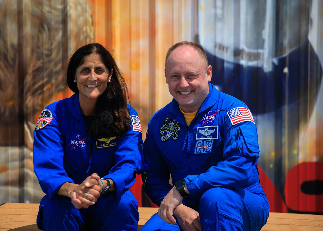 NASA astronauts Suni Williams, left, and Mike Fincke, right, pose for photographs while visiting NASA’s Kennedy Space Center in Florida, May 18, 2022, in advance of the agency’s Boeing Orbital Flight Test-2 (OFT-2) for NASA’s Commercial Crew Program. Boeing’s CST-100 Starliner spacecraft will launch atop a United Launch Alliance Atlas V rocket from Space Launch Complex-41 at Cape Canaveral Space Force Station on May 19, 2022. 