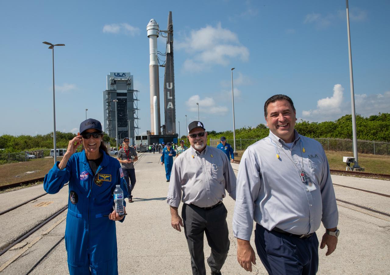 NASA astronaut Suni Williams, left, watches as a United Launch Alliance Atlas V rocket with Boeing’s CST-100 Starliner spacecraft aboard is rolled out of the Vertical Integration Facility to the launch pad at Space Launch Complex 41 ahead of the Orbital Flight Test-2 (OFT-2), Wednesday, May 18, 2022 at Cape Canaveral Space Force Station in Florida. Starliner is targeted to launch at 6:54 p.m. EDT on Thursday, May 19. OFT-2 is an important uncrewed flight test designed to test the end-to-end capabilities of the system to help the agency certify Starliner to carry astronauts to and from the International Space Station.