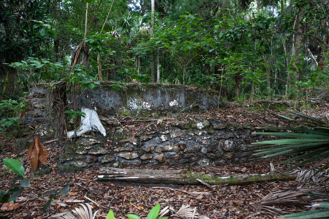Archeological ruins of the Elliot Plantation sugar mill are revealed through the oak hammock at NASA’s Kennedy Space Center in Florida on May 26, 2022. The plantation’s enslaved community built the sugar mill structure, or sugar train, where sugar cane juice would be boiled during processing in graduated copper kettles until the liquid reduced into a thick syrup. The ruins of Elliot Plantation date from the 1760s and represent the largest, earliest, and southernmost British period sugar plantation in the U.S., as well as one of the most intact and best examples of a completely preserved enslaved landscape. The archeological site is managed through interagency cooperation between the National Park Service, the U.S. Fish and Wildlife Service, and NASA.